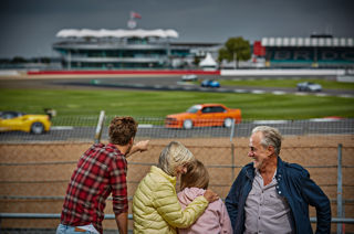 Family Group watching racing on Silverstone Circuit from Luffield