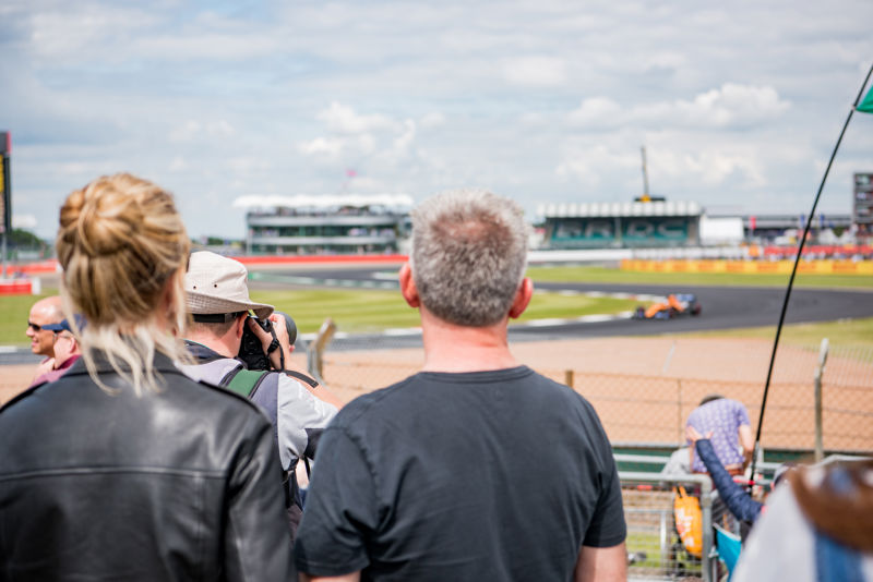 Crowd on Luffield looking at McLaren on Silverstone Circuit